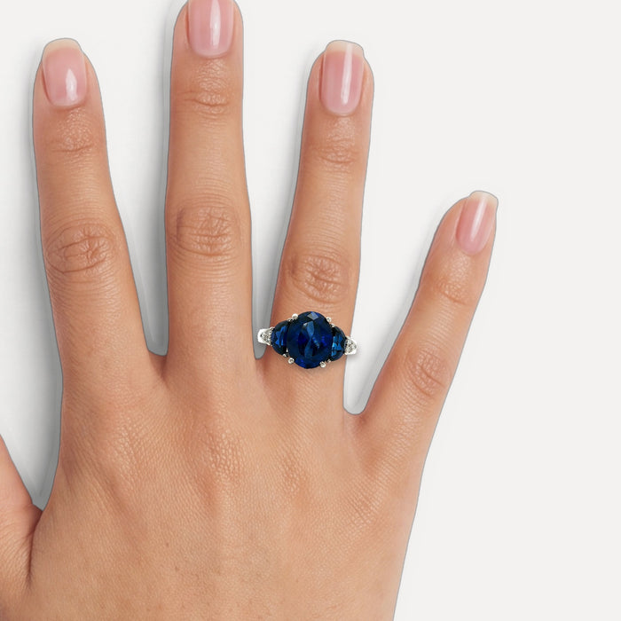 Moon Phase Sapphire Colored CZ Triple-Stone Ring in Sterling Silver shown on a hand (medium skin tone)