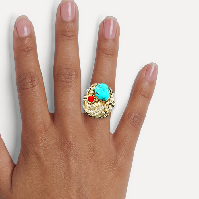 Native American Navajo Turquoise and Coral Bald Eagle Ring in Sterling Silver shown on a hand (medium deep skin tone)