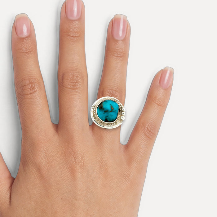 Deep Turquoise Cocktail Ring in Sterling Silver shown on a hand (medium skin tone)