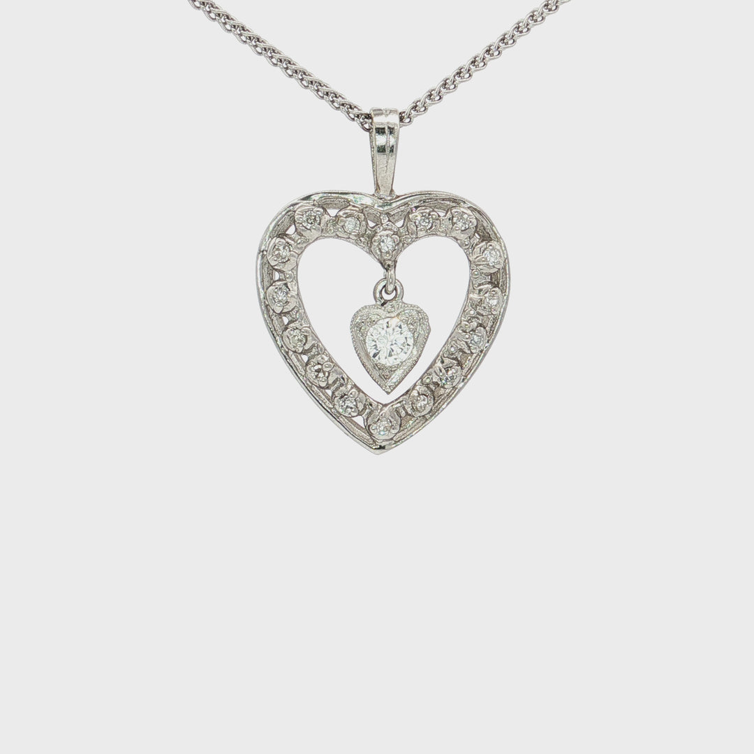 0.25 CTW Natural Round Brilliant Cut Near Colorless Diamonds in an Open Heart Pendant with a Small Dangling Heart Inside in 14kt White Gold